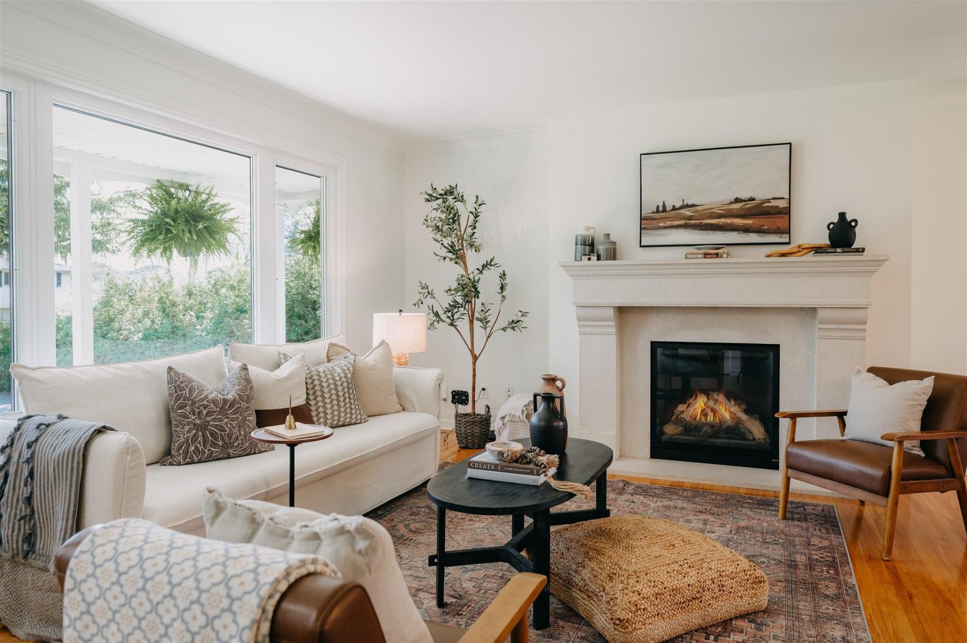 Living room with fireplace and bright windows at 1115 Jarvis Avenue